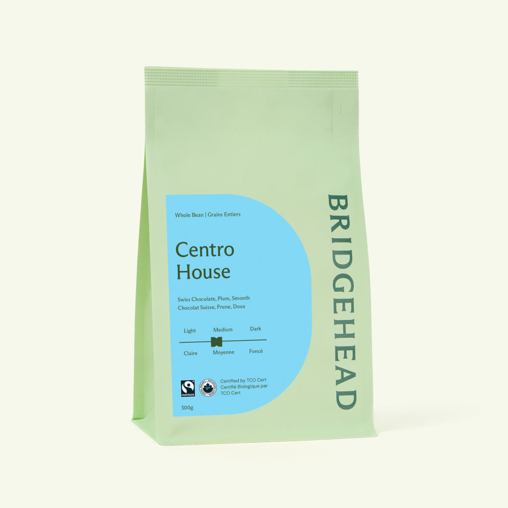 Green coffee bag with Centro House branding on a white background